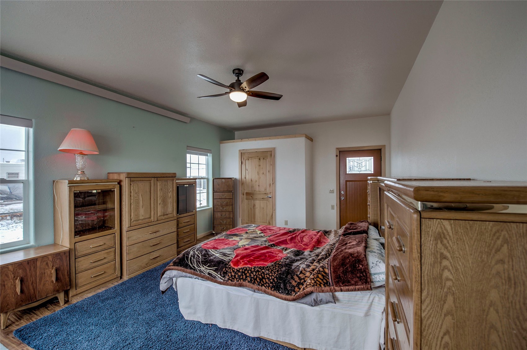 1620 Trout Road Fairplay, CO 80440 - Photo 10 of 31 Bedroom featuring hardwood / wood-style floors, ceiling fan, and multiple windows
