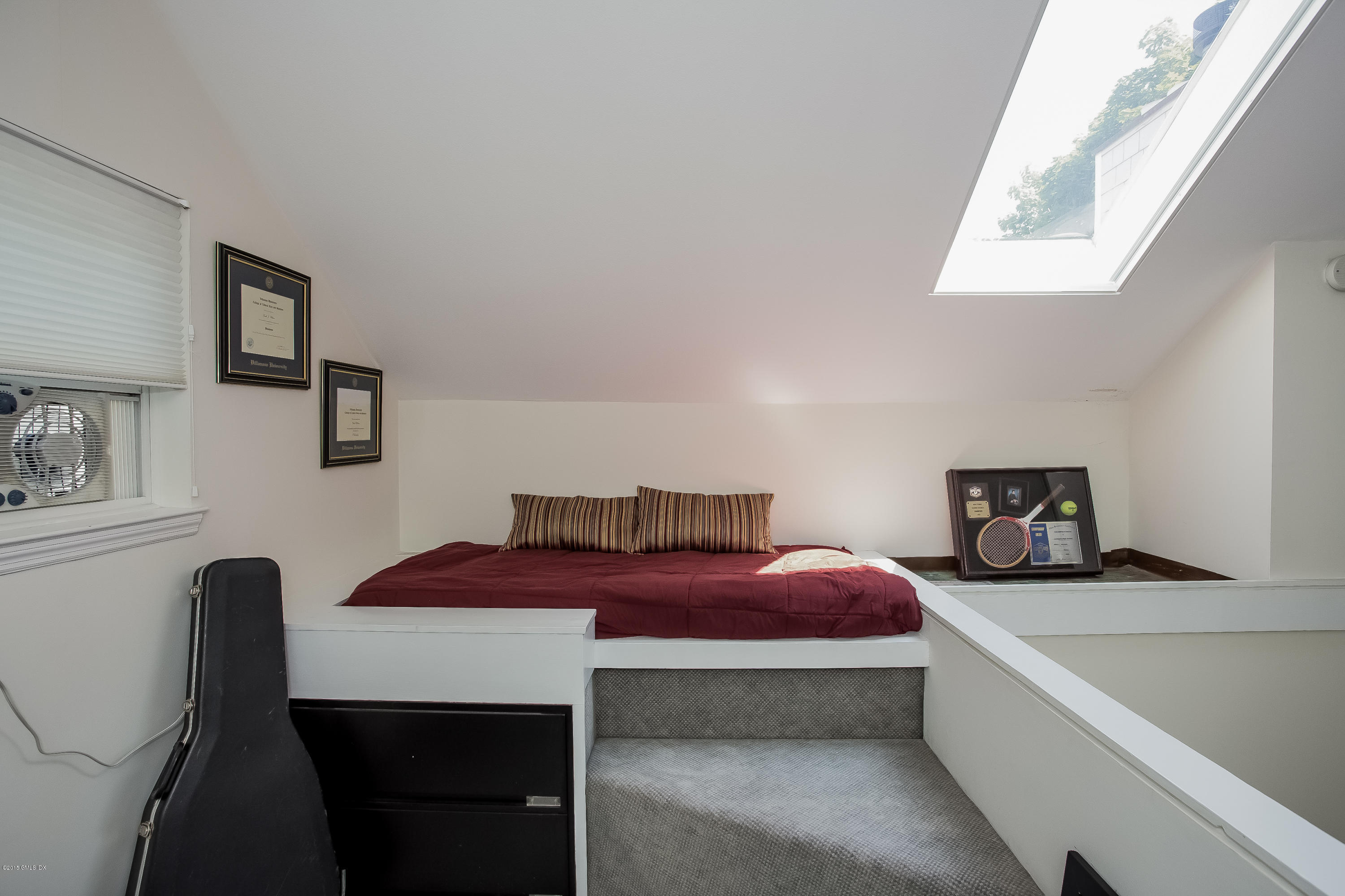 100 Strickland Road, Unit 9 Cos Cob, CT 06807 - Photo 11 of 21 a bedroom with a bed and a window