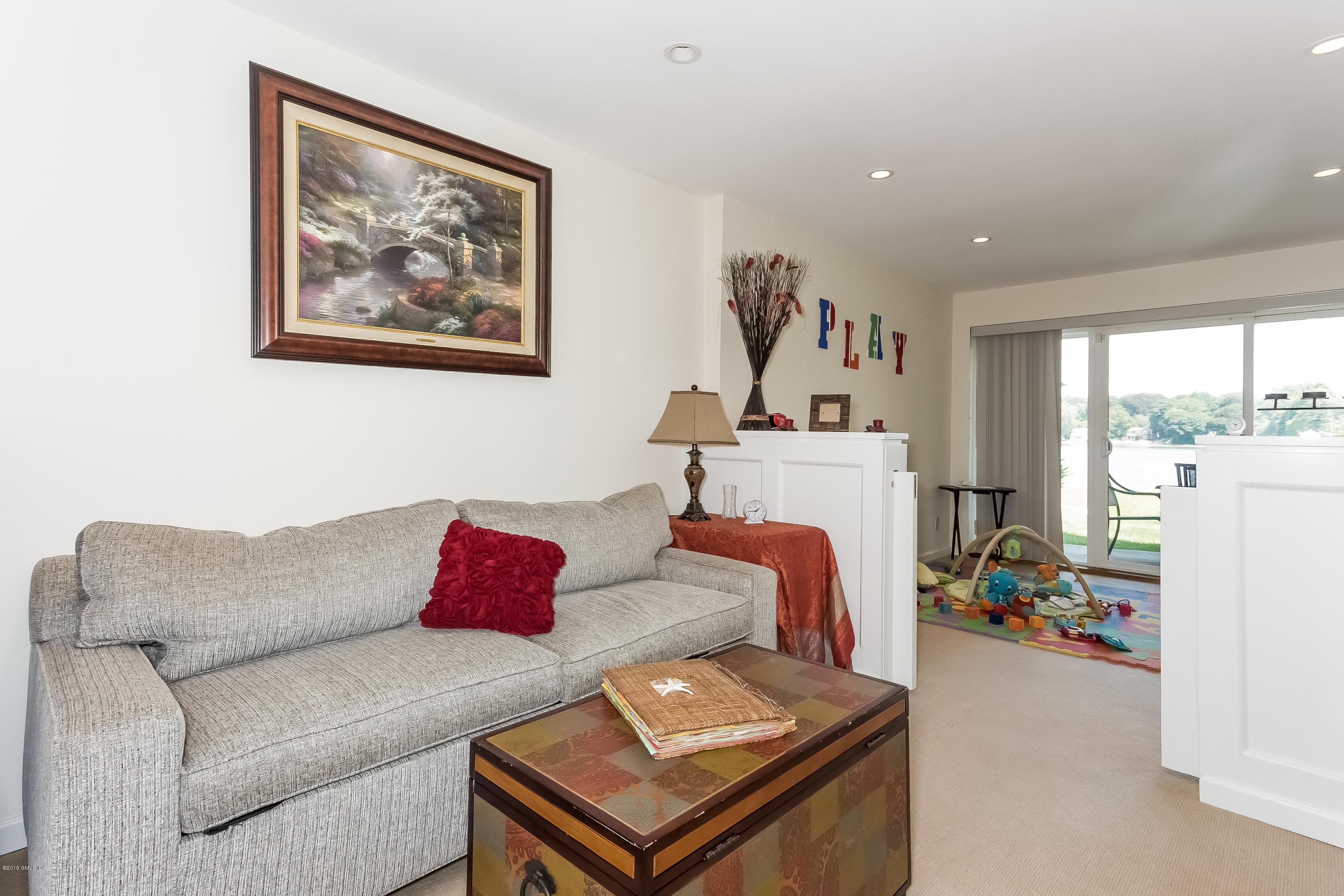 100 Strickland Road, Unit 9 Cos Cob, CT 06807 - Photo 12 of 21 a living room with furniture and a couch