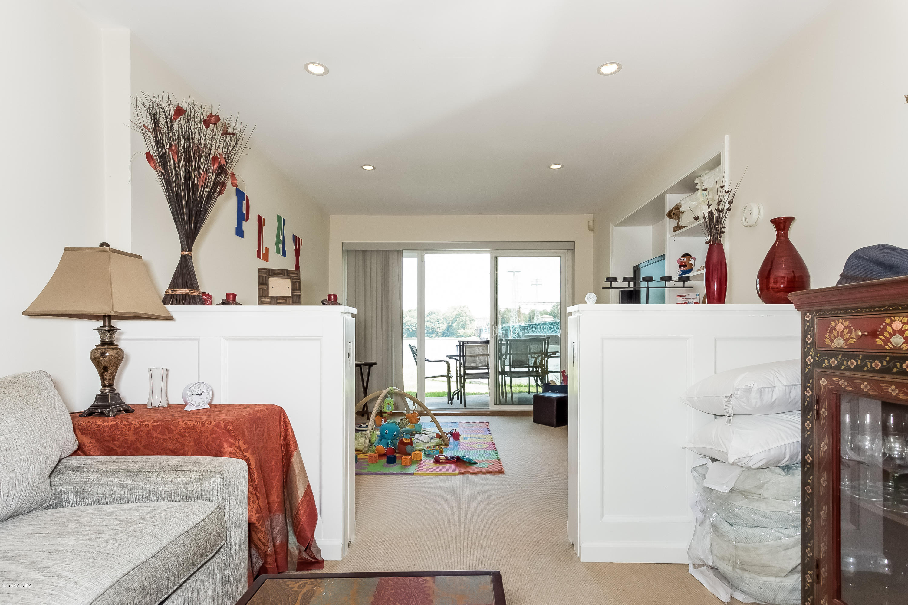 100 Strickland Road, Unit 9 Cos Cob, CT 06807 - Photo 13 of 21 a living room with furniture and a window
