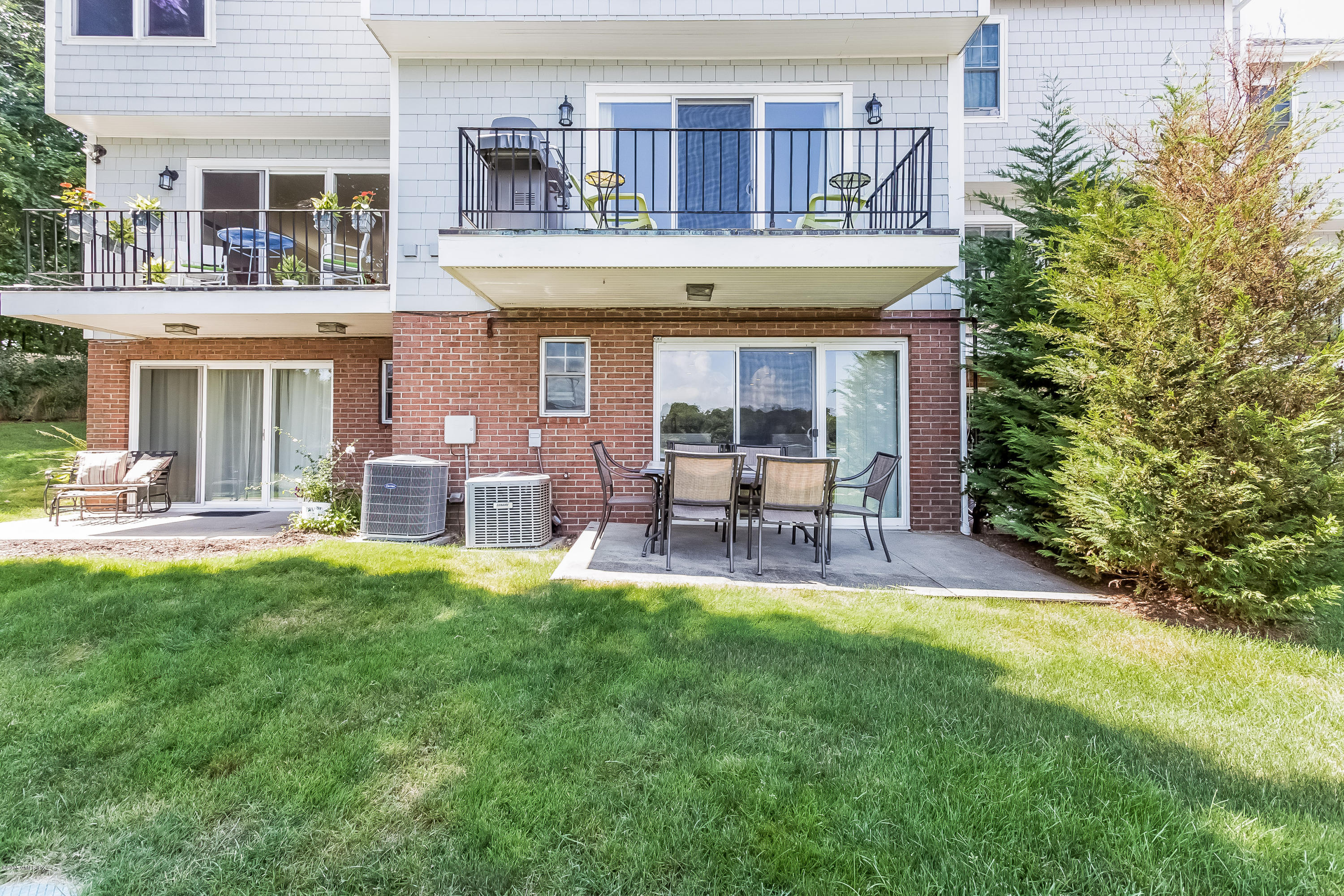 100 Strickland Road, Unit 9 Cos Cob, CT 06807 - Photo 14 of 21 a house view with sitting space and garden space