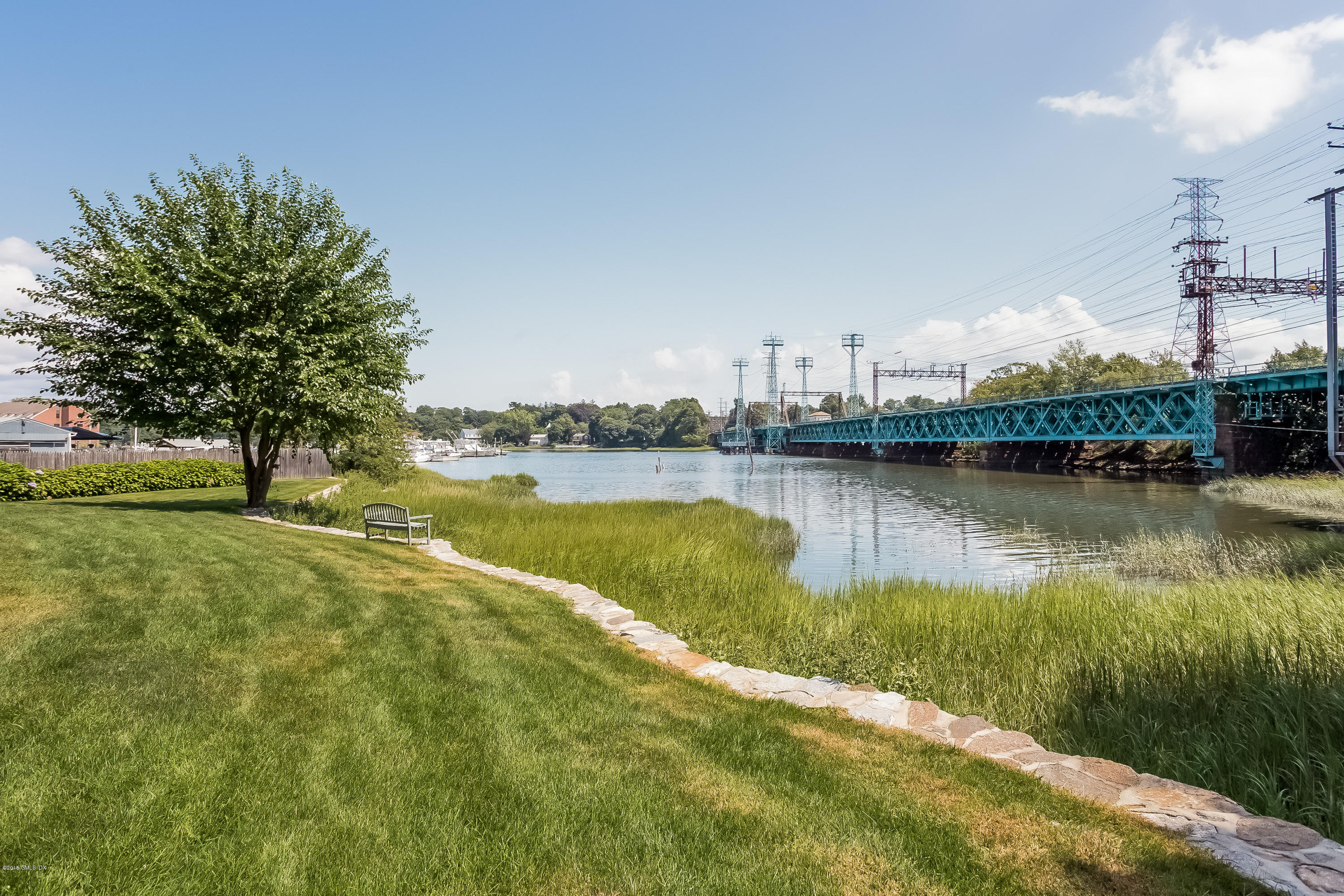 100 Strickland Road, Unit 9 Cos Cob, CT 06807 - Photo 17 of 21 a view of a lake with houses in the back