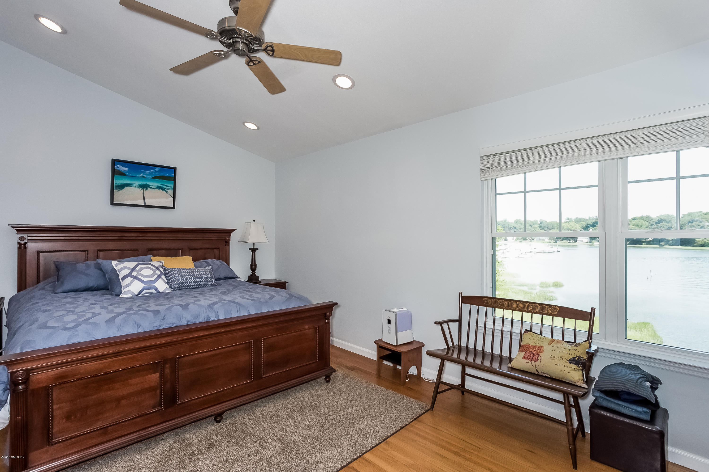 100 Strickland Road, Unit 9 Cos Cob, CT 06807 - Photo 8 of 21 a bedroom with furniture and window