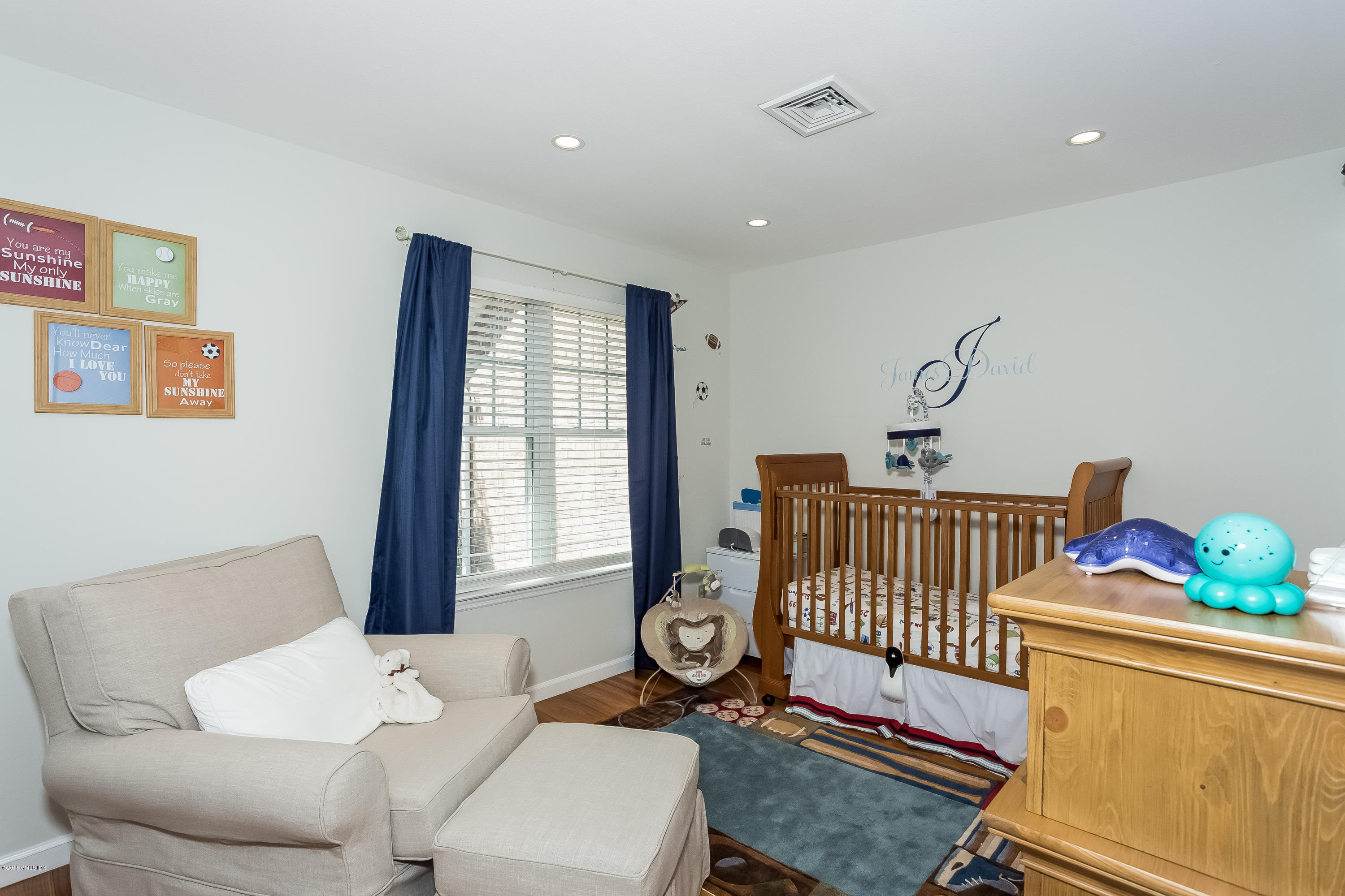 100 Strickland Road, Unit 9 Cos Cob, CT 06807 - Photo 9 of 21 a bedroom with furniture and a window
