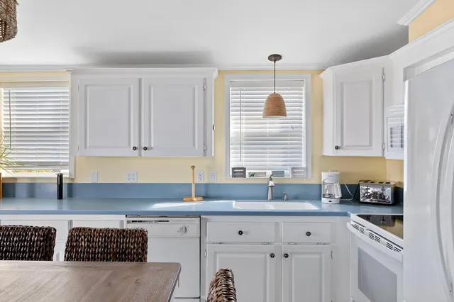 a view of hall way with furniture