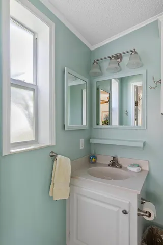 a bedroom with a bed and a television