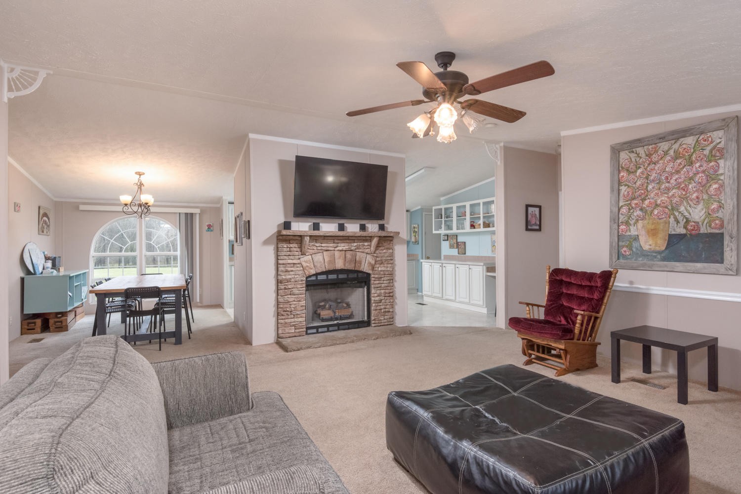 929 Hunt Road Cleveland, TN 37323 - Photo 1 of 26 a living room with furniture a fireplace and a flat screen tv