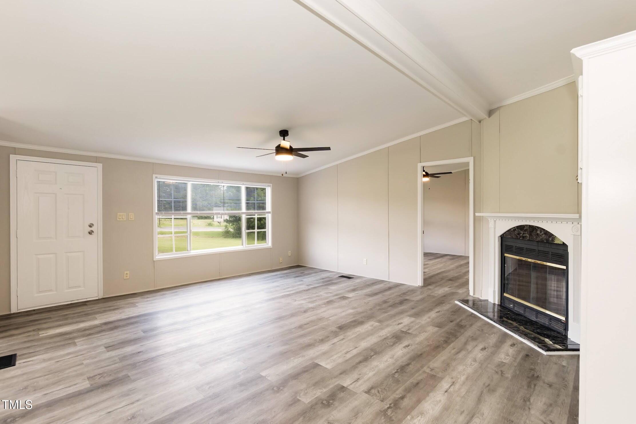 40 Beaver Run Road Spring Hope, NC 27882 - Photo 11 of 28 wooden floor in an empty room with a window