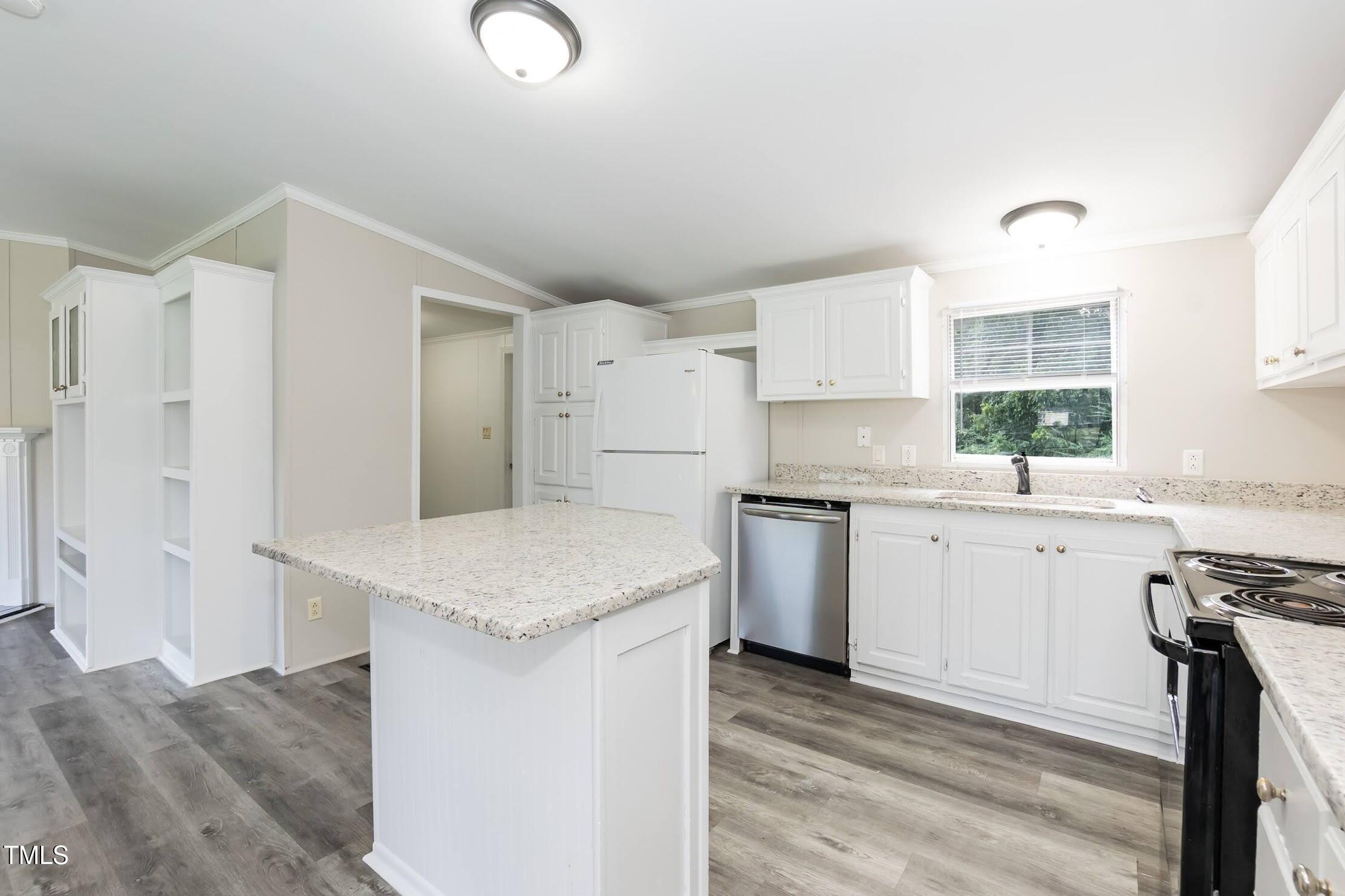 40 Beaver Run Road Spring Hope, NC 27882 - Photo 16 of 28 a kitchen with a sink stove and cabinets