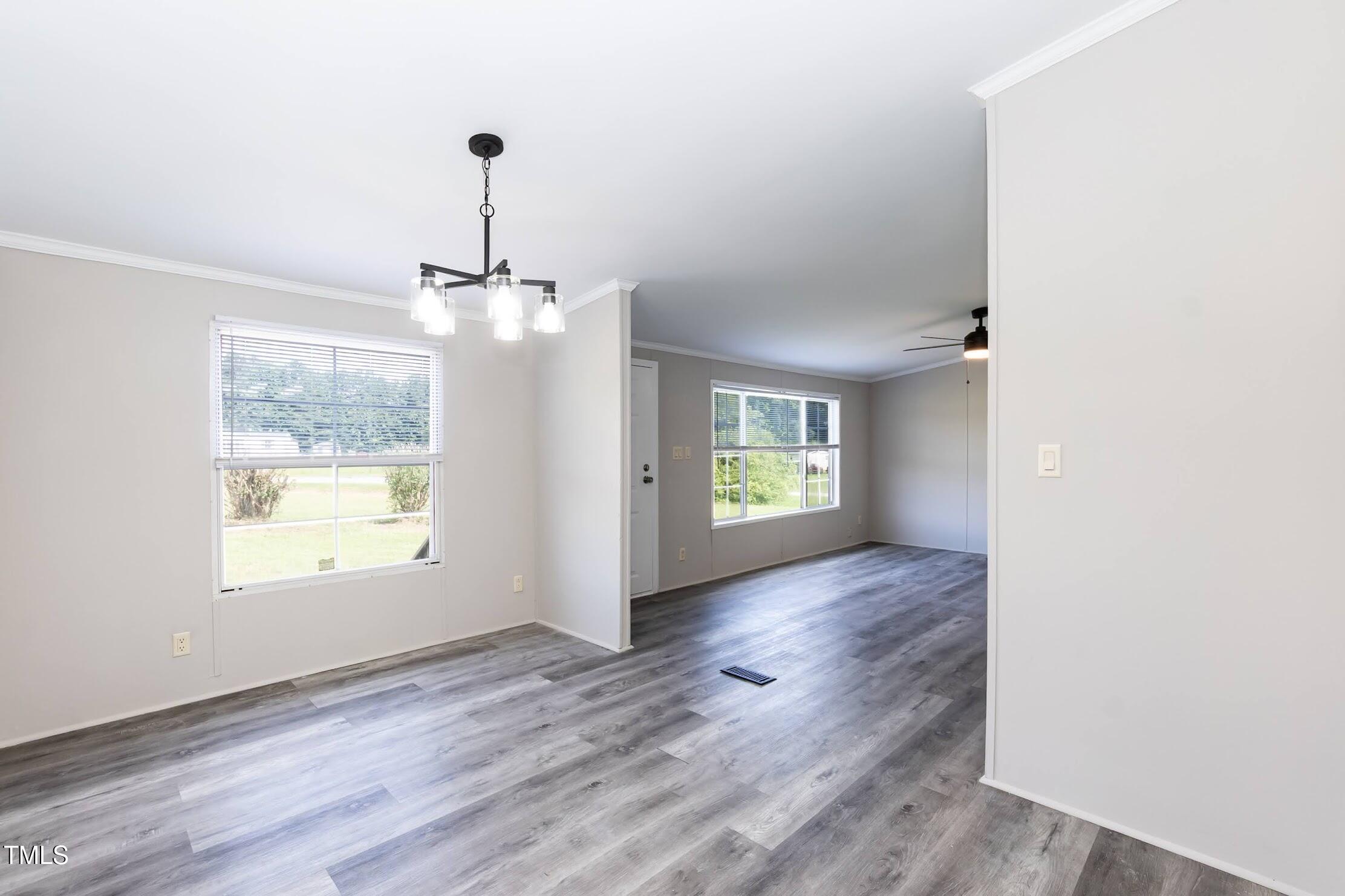 40 Beaver Run Road Spring Hope, NC 27882 - Photo 19 of 28 a view of an empty room with window and wooden floor