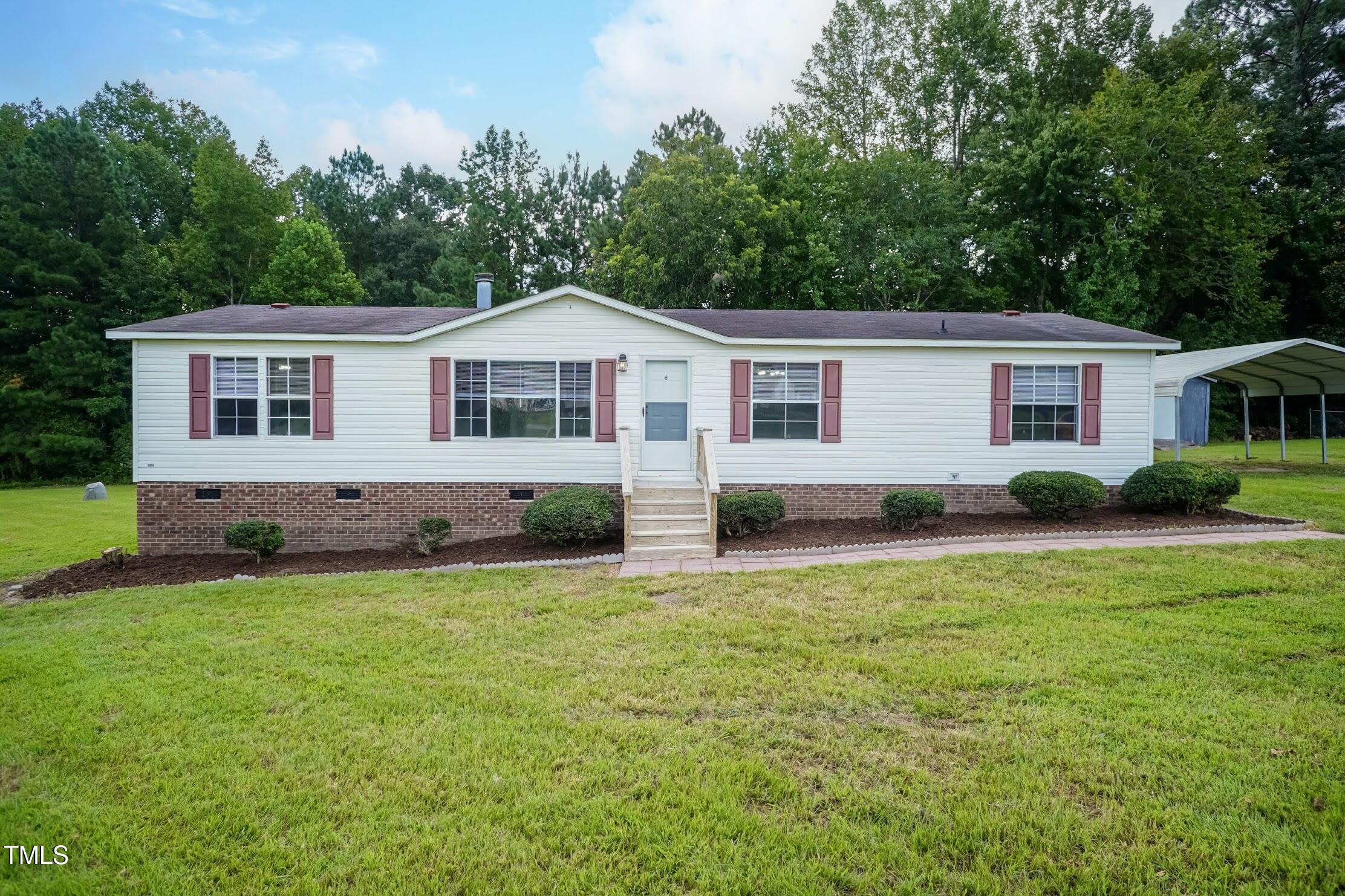 40 Beaver Run Road Spring Hope, NC 27882 - Photo 2 of 28 a front view of house with yard and trees around