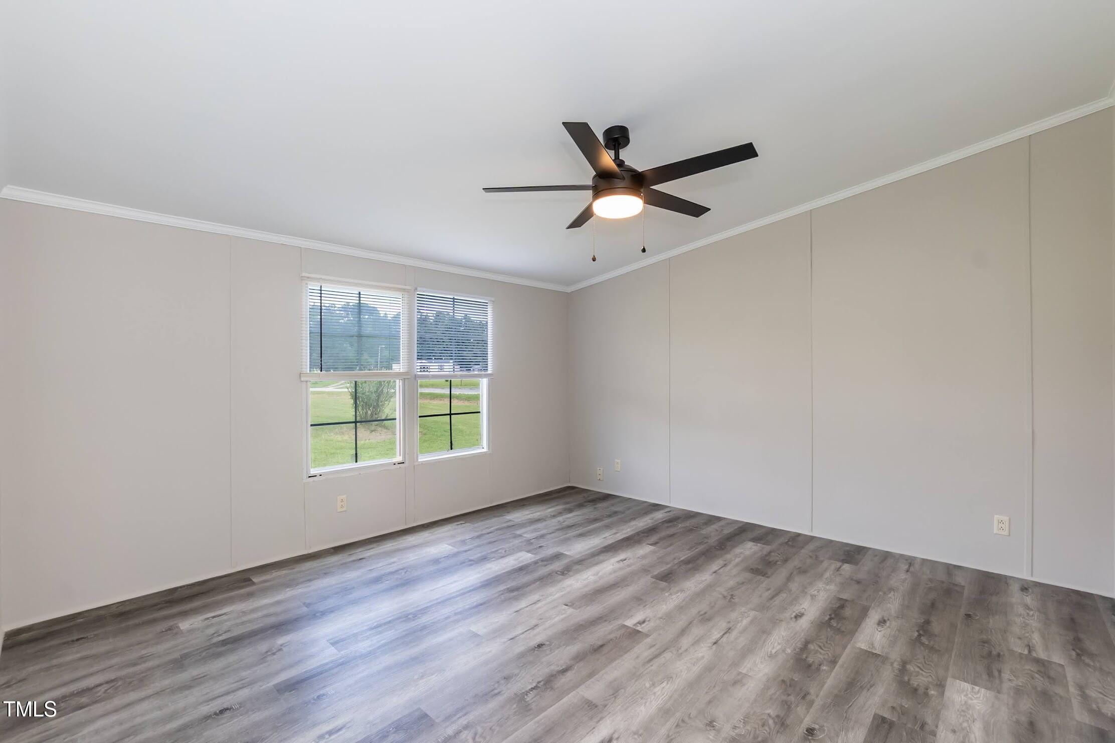 40 Beaver Run Road Spring Hope, NC 27882 - Photo 21 of 28 an empty room with wooden floor and windows