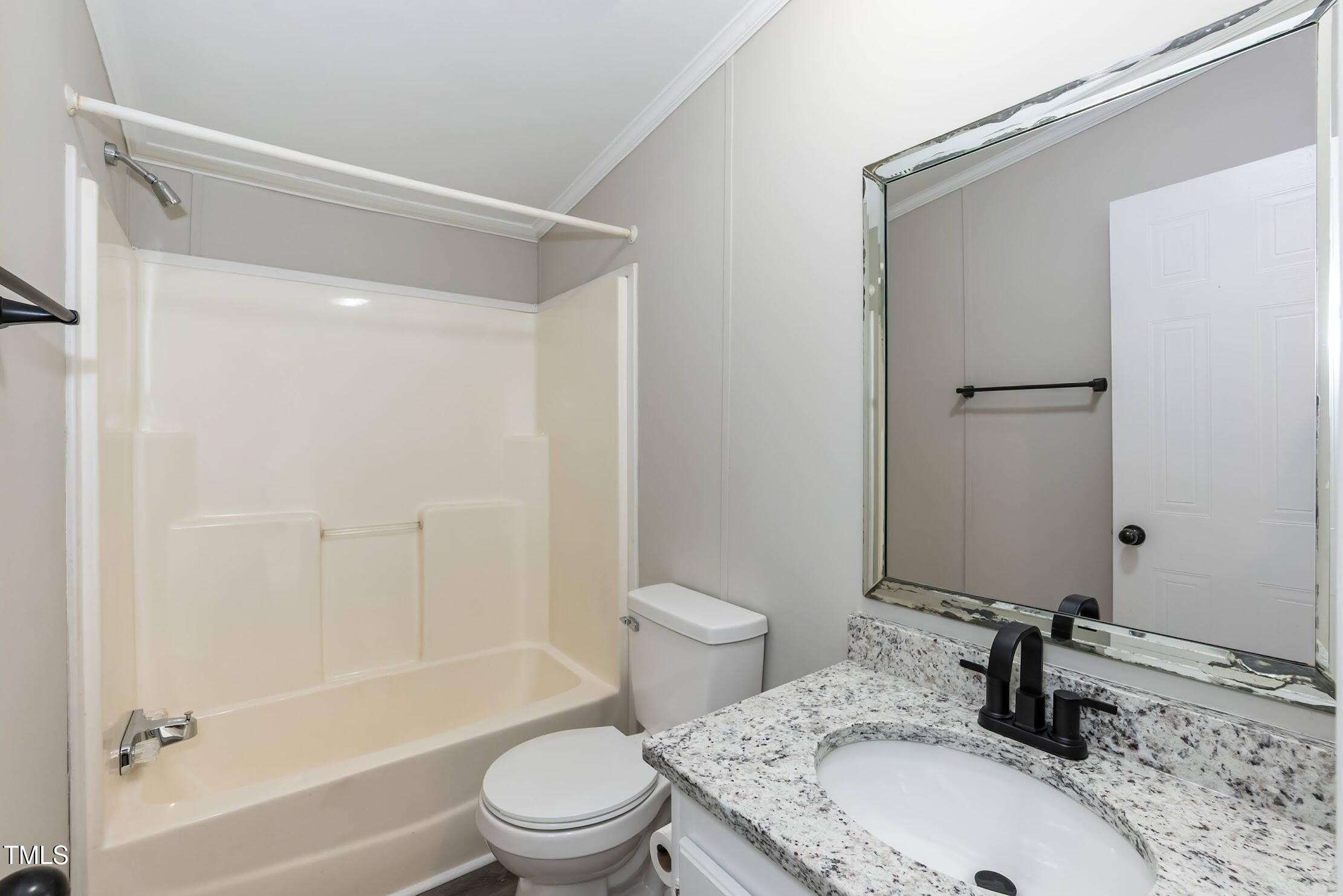 40 Beaver Run Road Spring Hope, NC 27882 - Photo 28 of 28 a bathroom with a granite countertop sink toilet and shower