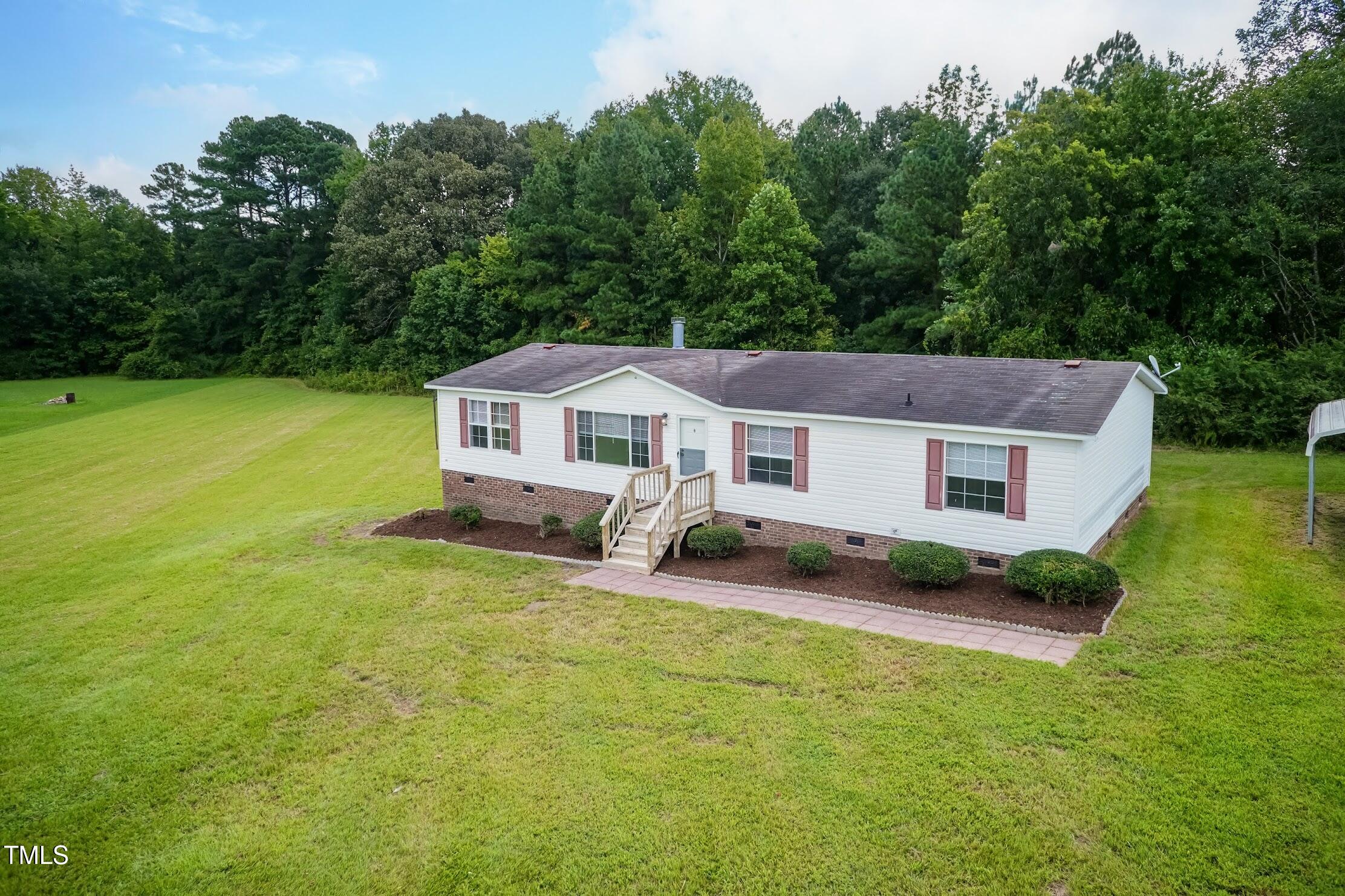 40 Beaver Run Road Spring Hope, NC 27882 - Photo 3 of 28 a aerial view of a house next to a big yard and large trees