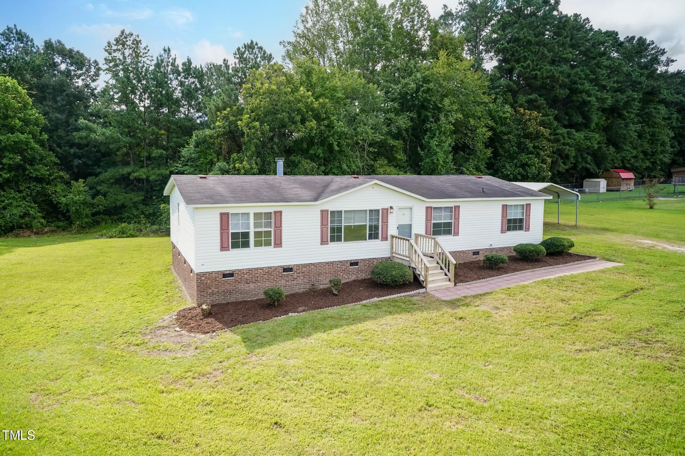 40 Beaver Run Road Spring Hope, NC 27882 - Photo 4 of 28 a front view of a house with a yard