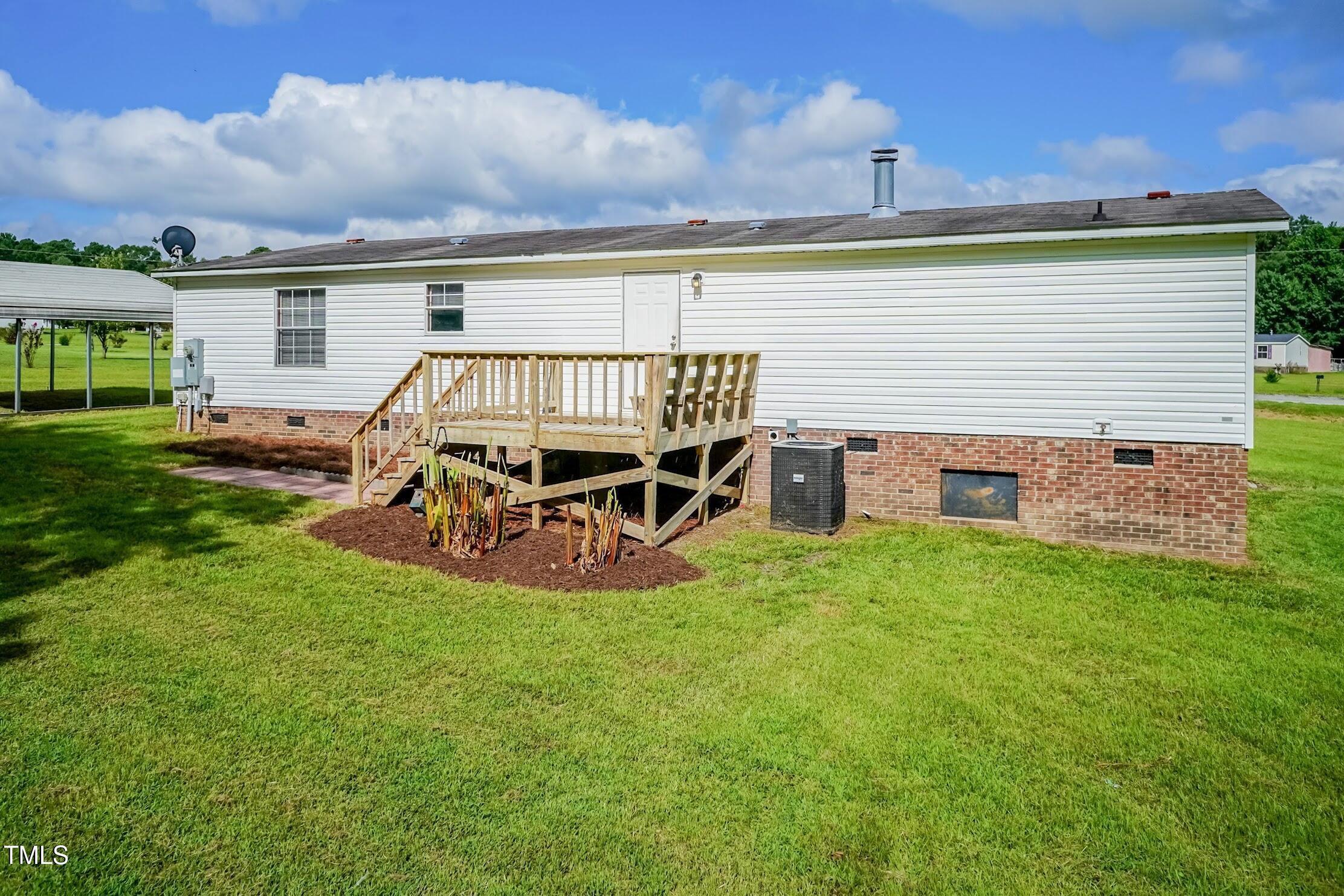 40 Beaver Run Road Spring Hope, NC 27882 - Photo 7 of 28 a view of a house with backyard porch and sitting area