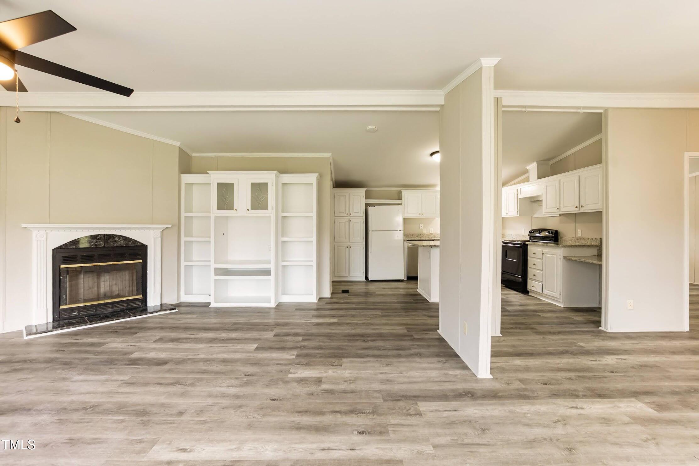 40 Beaver Run Road Spring Hope, NC 27882 - Photo 9 of 28 a view of a kitchen with a stove cabinets and wooden floor
