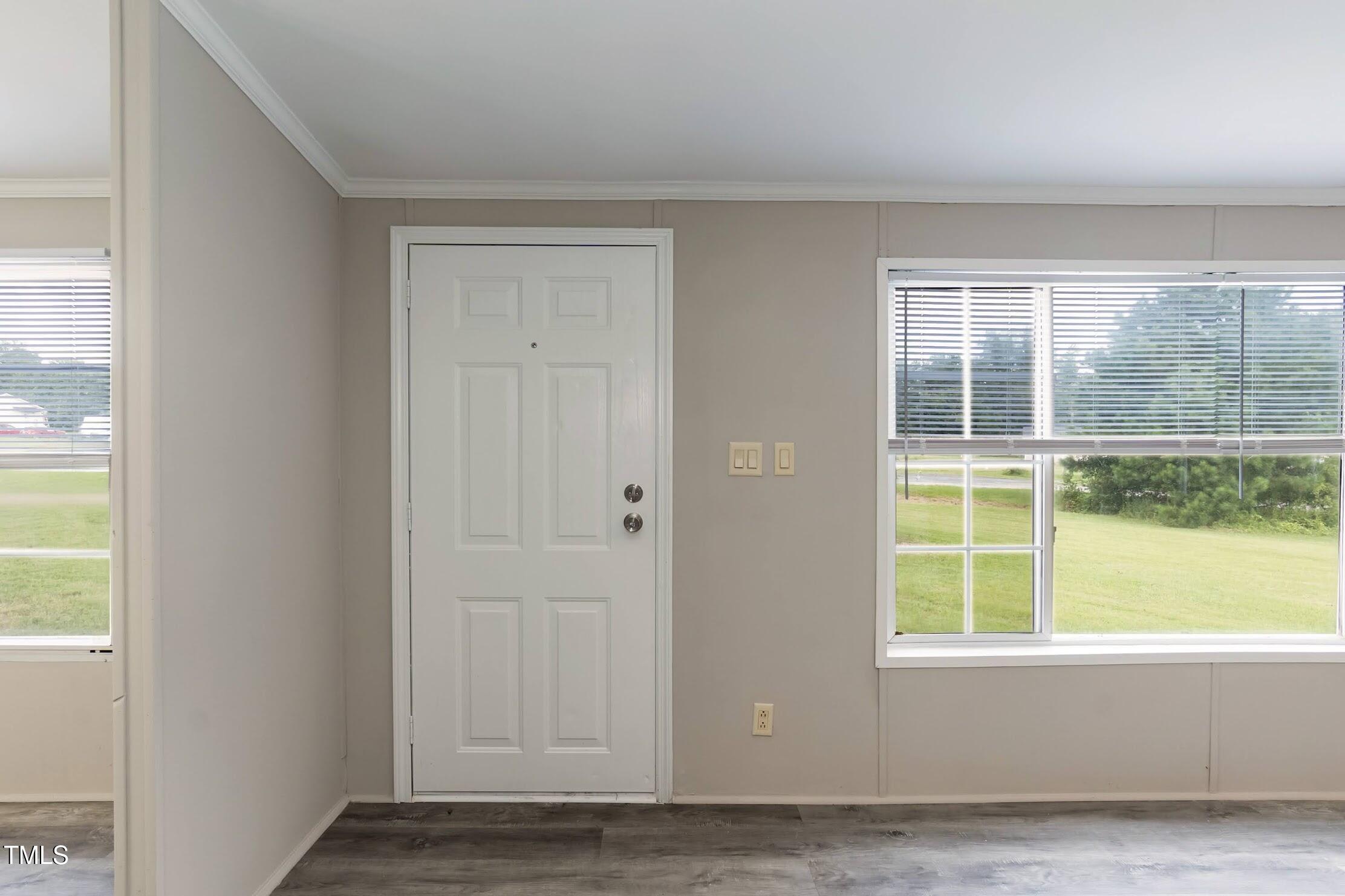 40 Beaver Run Road Spring Hope, NC 27882 - Photo 10 of 28 an empty room with wooden floor and windows