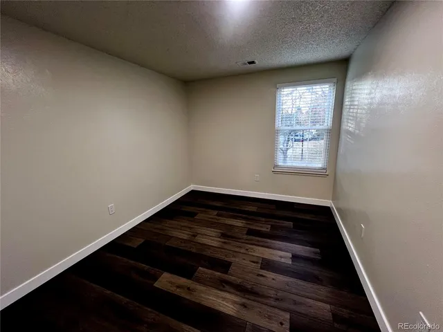 a view of wooden floor in an empty room