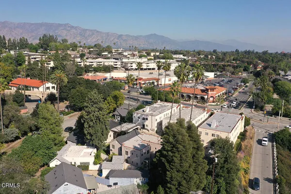 an aerial view of residential houses with outdoor space