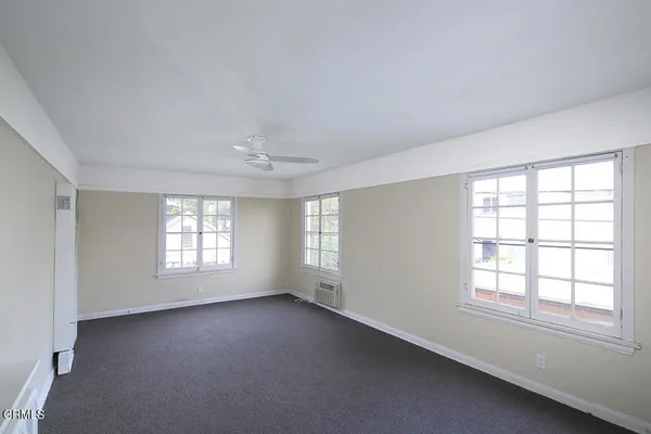 a view of an empty room with a window