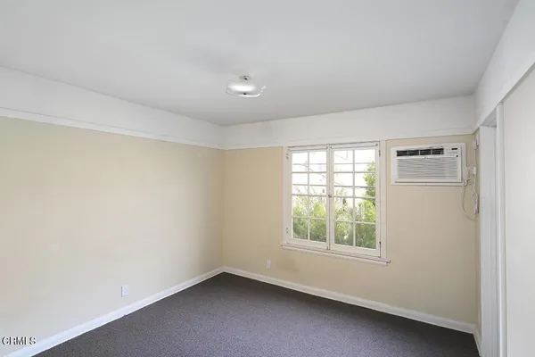 a view of a small space with racks on the wall