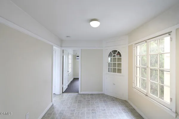 a view of an empty room with a window