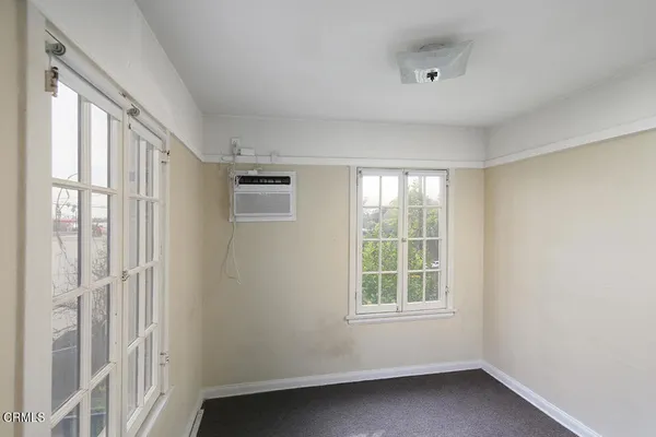 a view of an empty room with a window