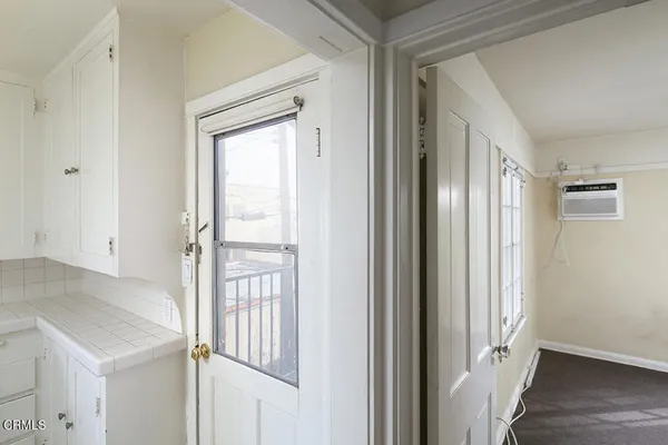 a bathroom with a sink and a window