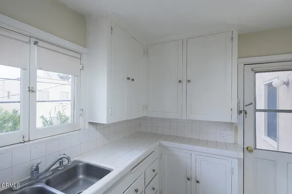 a swimming pool with outdoor seating and yard