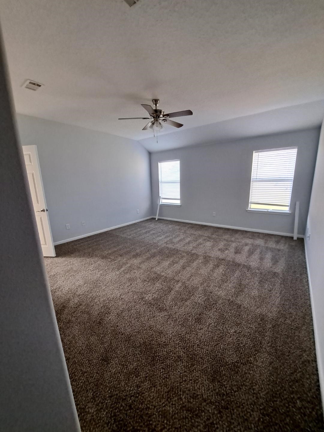 7411 Augusta Lane Rosharon, TX 77583 - Photo 20 of 38 wooden floor in an empty room with a window