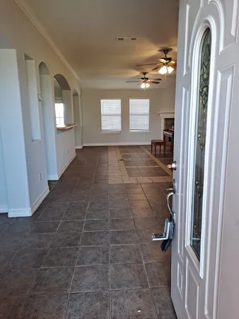 a view of entryway and hall with a window