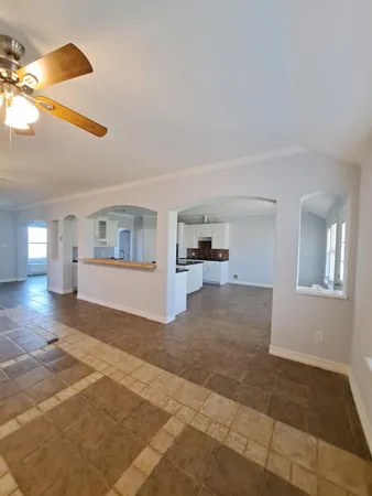 a view of a livingroom with wooden floor and a cabinet
