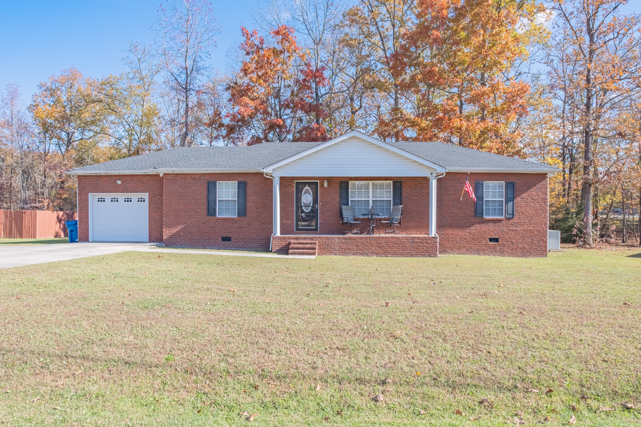 353 Oak Hollow Road Manchester, TN 37355 - Photo 1 of 32 a front view of a house with a yard and garage