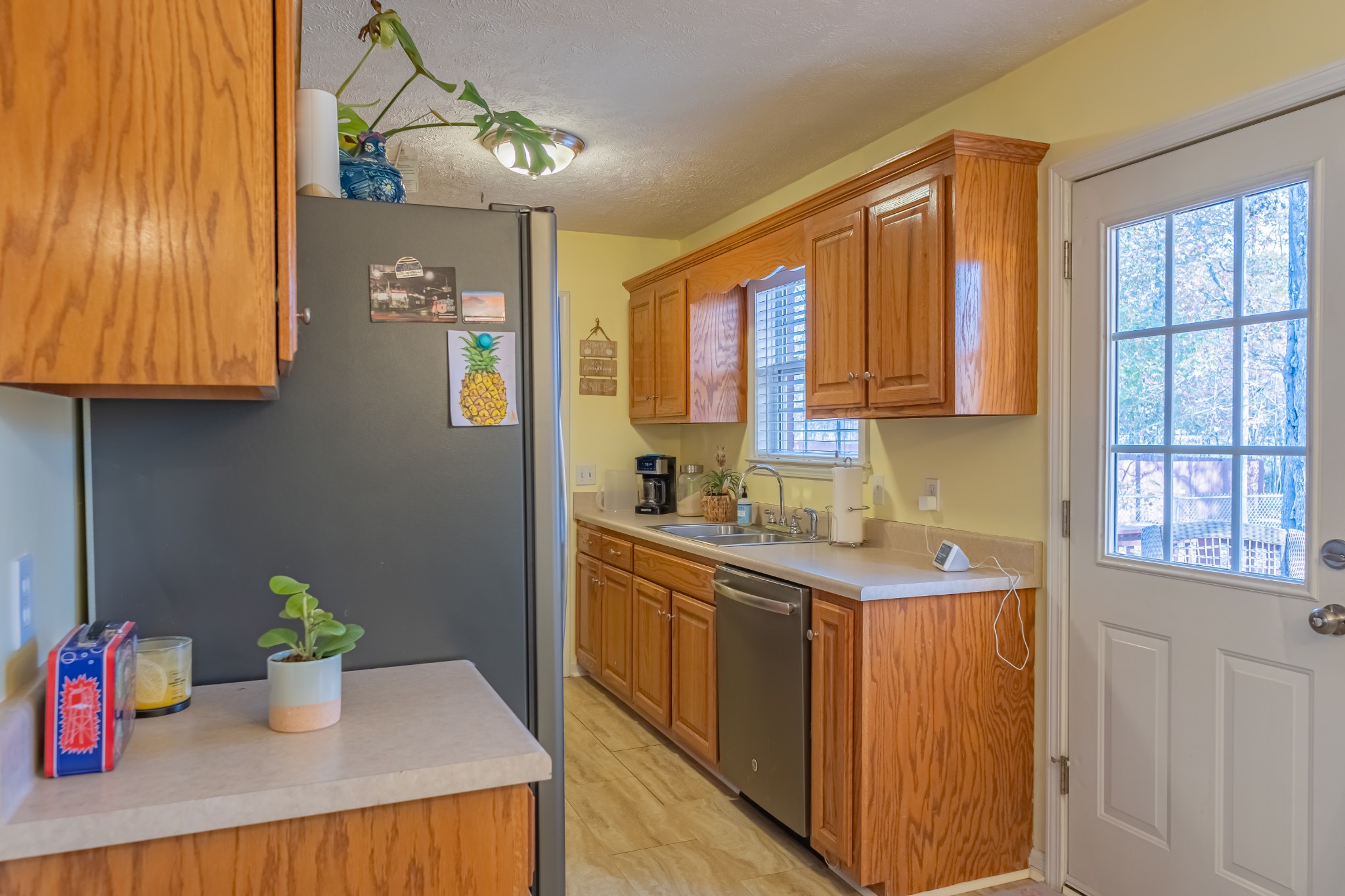 353 Oak Hollow Road Manchester, TN 37355 - Photo 19 of 32 a kitchen with a sink cabinets and window