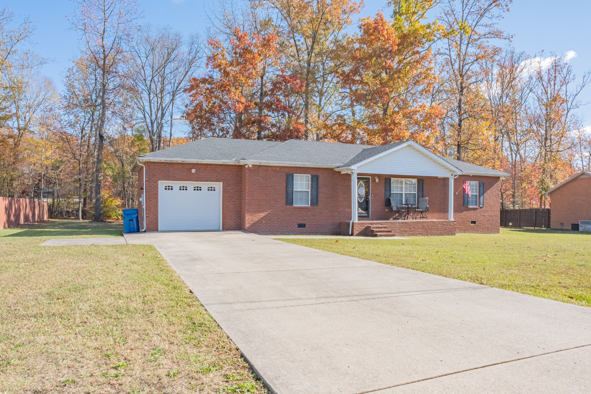 353 Oak Hollow Road Manchester, TN 37355 - Photo 2 of 32 a front view of a house with a yard and garage
