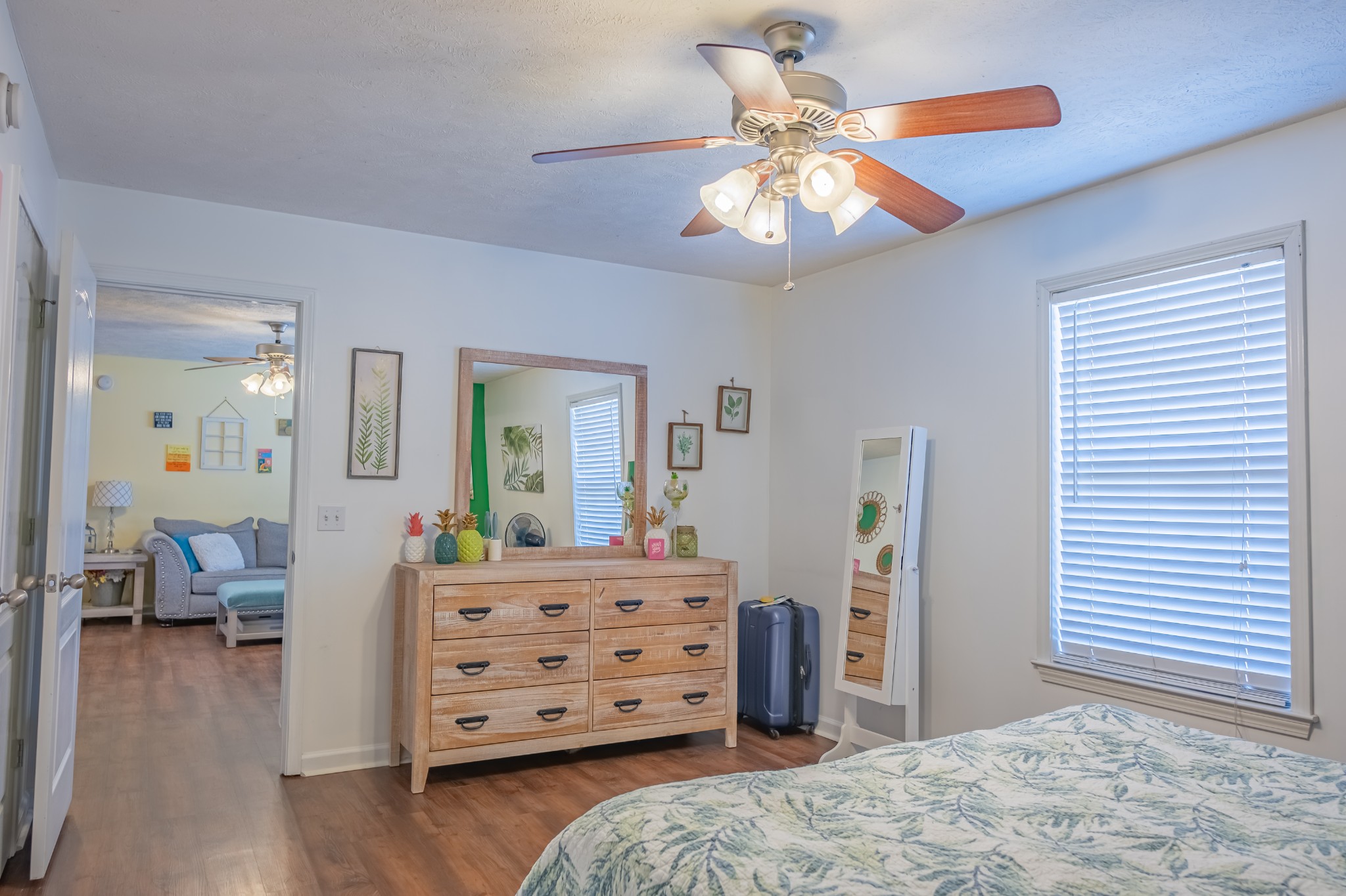 353 Oak Hollow Road Manchester, TN 37355 - Photo 21 of 32 a bedroom with a bed and wooden floor