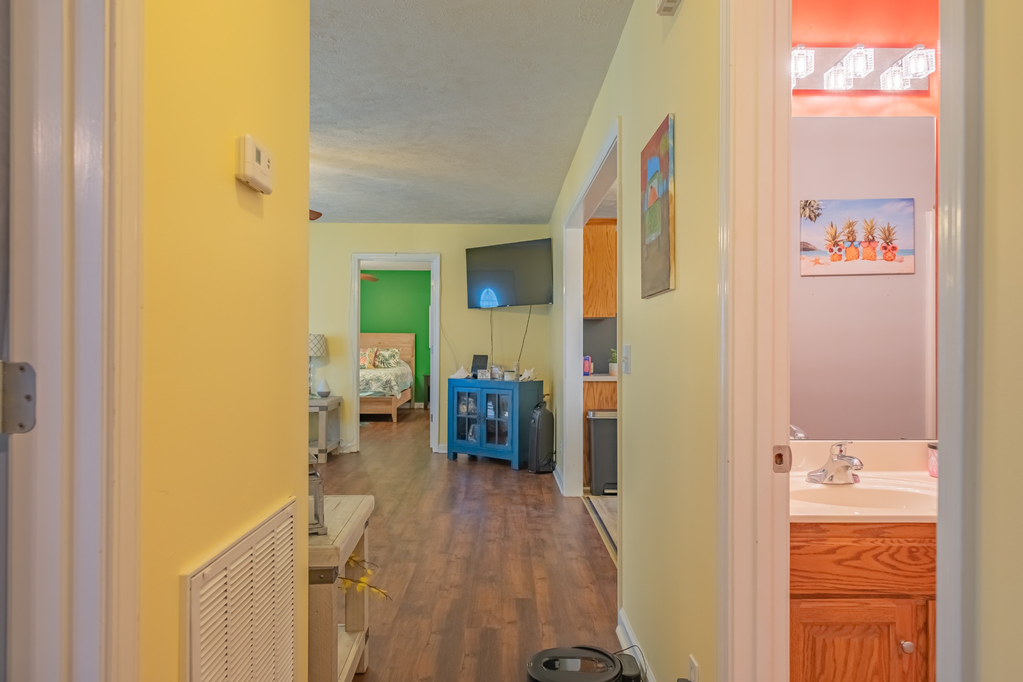 353 Oak Hollow Road Manchester, TN 37355 - Photo 28 of 32 a view of a hallway with bathroom and wooden floor