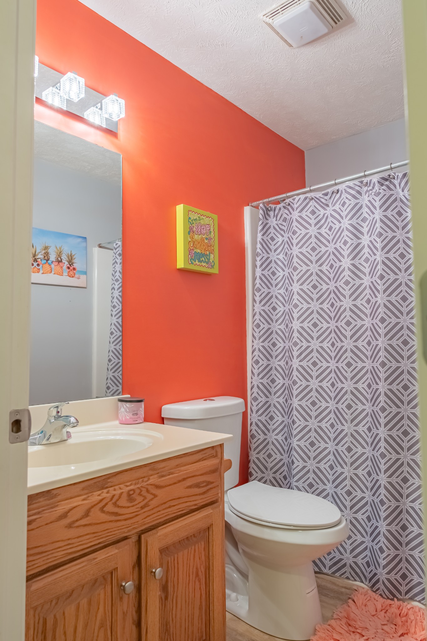 353 Oak Hollow Road Manchester, TN 37355 - Photo 30 of 32 a bathroom with a granite countertop toilet sink and mirror