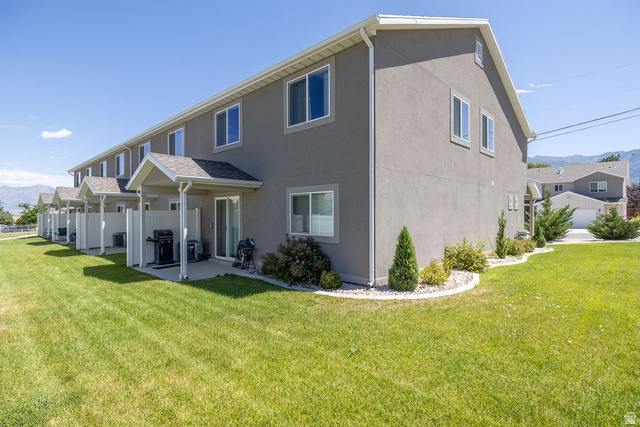 4991 South 475 West Washington Terrace, UT 84405 - Photo 29 of 31 Townhome exterior with stucco siding and white trim. Green space around this END UNIT.
