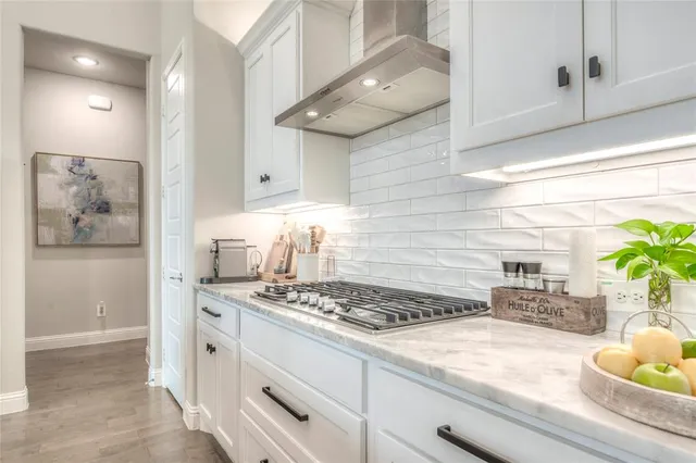 a living room with furniture a flat screen tv and a large window