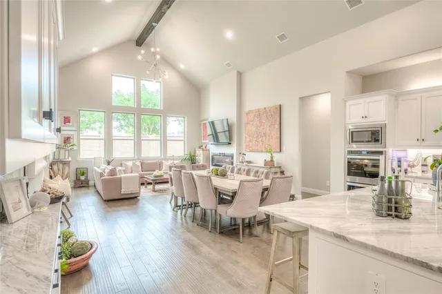 a spacious bedroom with a bed and a large window