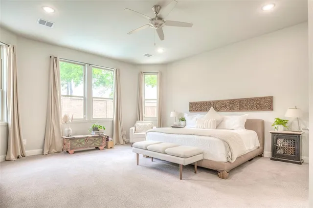 a bathroom with a granite countertop sink a toilet and shower