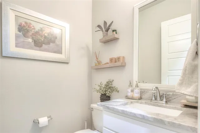 a living room with furniture and a air conditioner vent