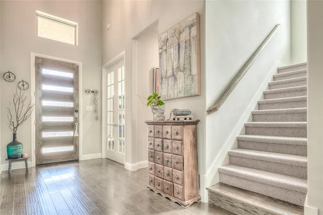 a kitchen with stainless steel appliances kitchen island granite countertop a table and chairs