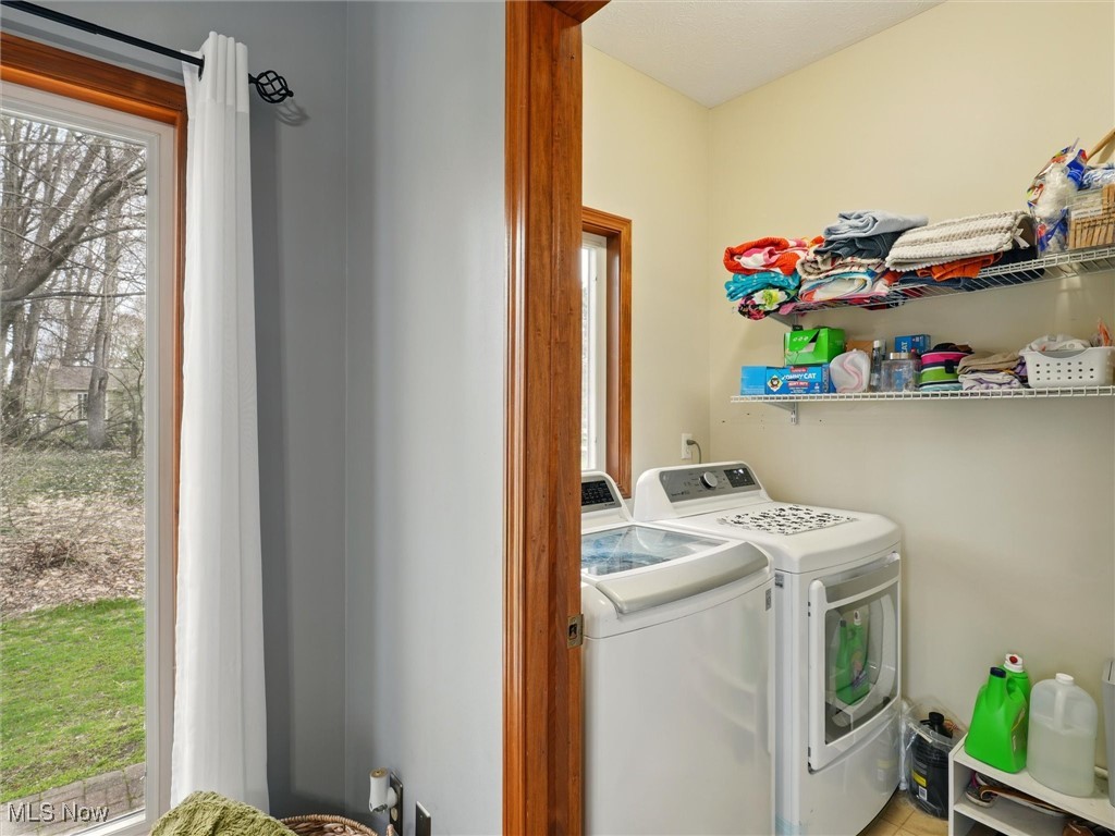 2068 Chimney Ridge Drive Madison, OH 44057 - Photo 15 of 37 Laundry area with washing machine and clothes dryer and laundry area on main floor