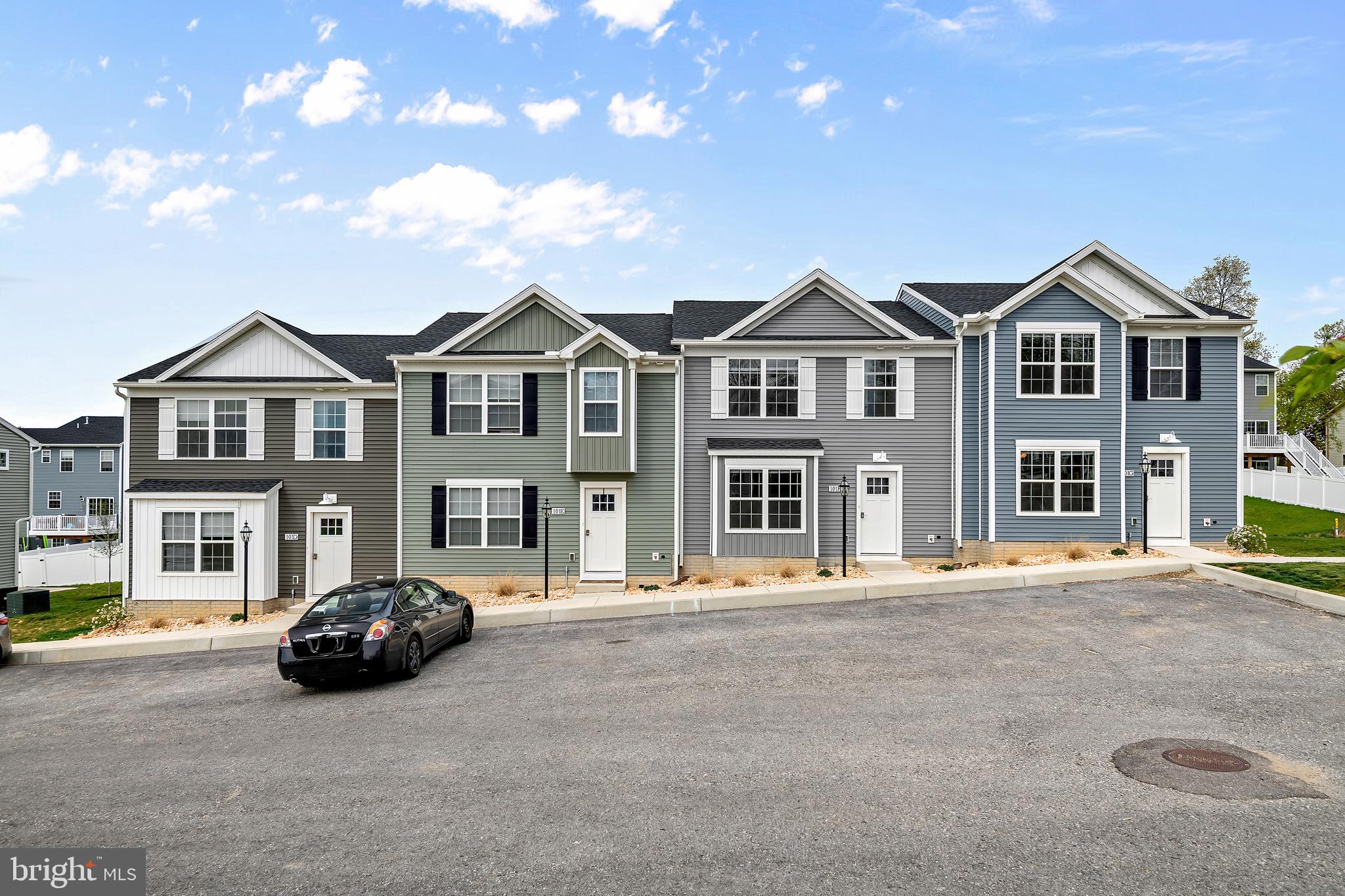 0 H Street, Unit 7 Carlisle, PA 17013 - Photo 1 of 19 a front view of a house with a garden
