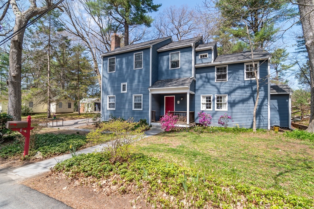 8 Meeting House Hill Road Dover, MA 02030 - Photo 1 of 22 a view of a brick house with a yard and large tree