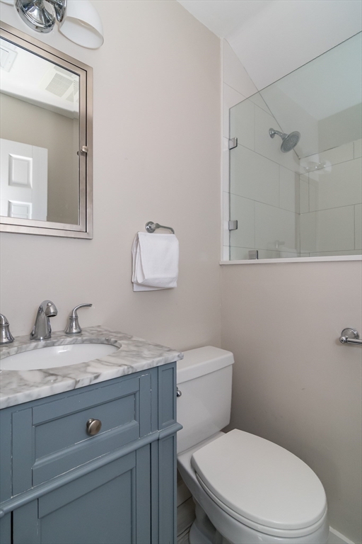 8 Meeting House Hill Road Dover, MA 02030 - Photo 13 of 22 a white toilet sitting next to a bathroom sink
