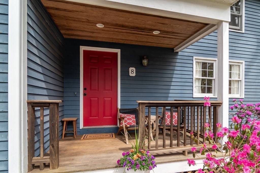 8 Meeting House Hill Road Dover, MA 02030 - Photo 2 of 22 a front view of a house with a porch